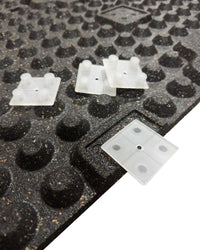 Black rubber gym floor tile with 30mm thickness from Gym Gear, showing interlocking connector blocks for easy installation.