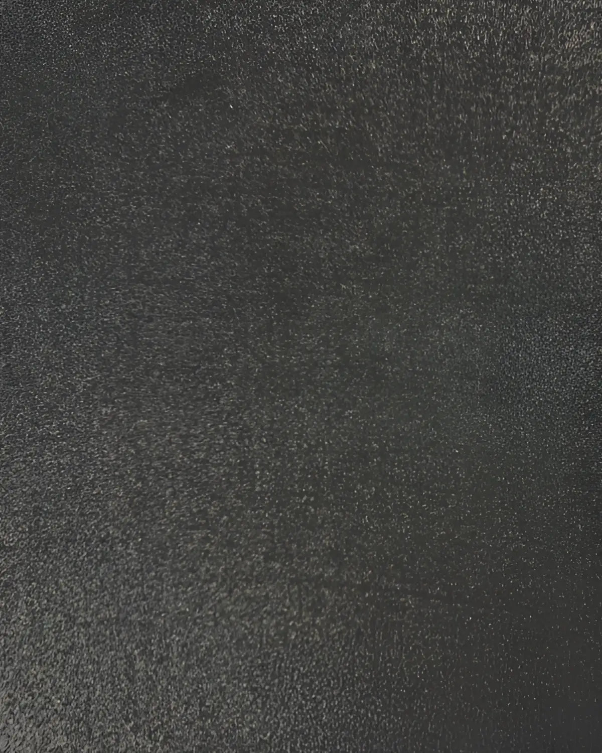Black rubber gym floor tile with textured surface, 30mm thickness, from Gym Gear, measuring 1m by 0.5m, ideal for workout areas.