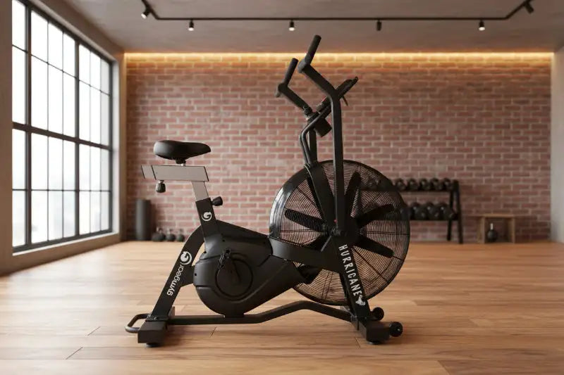 Gym Gear Hurricane Air Bike, a cardio machine with a sturdy frame, adjustable seat, and handlebar for full-body workout.