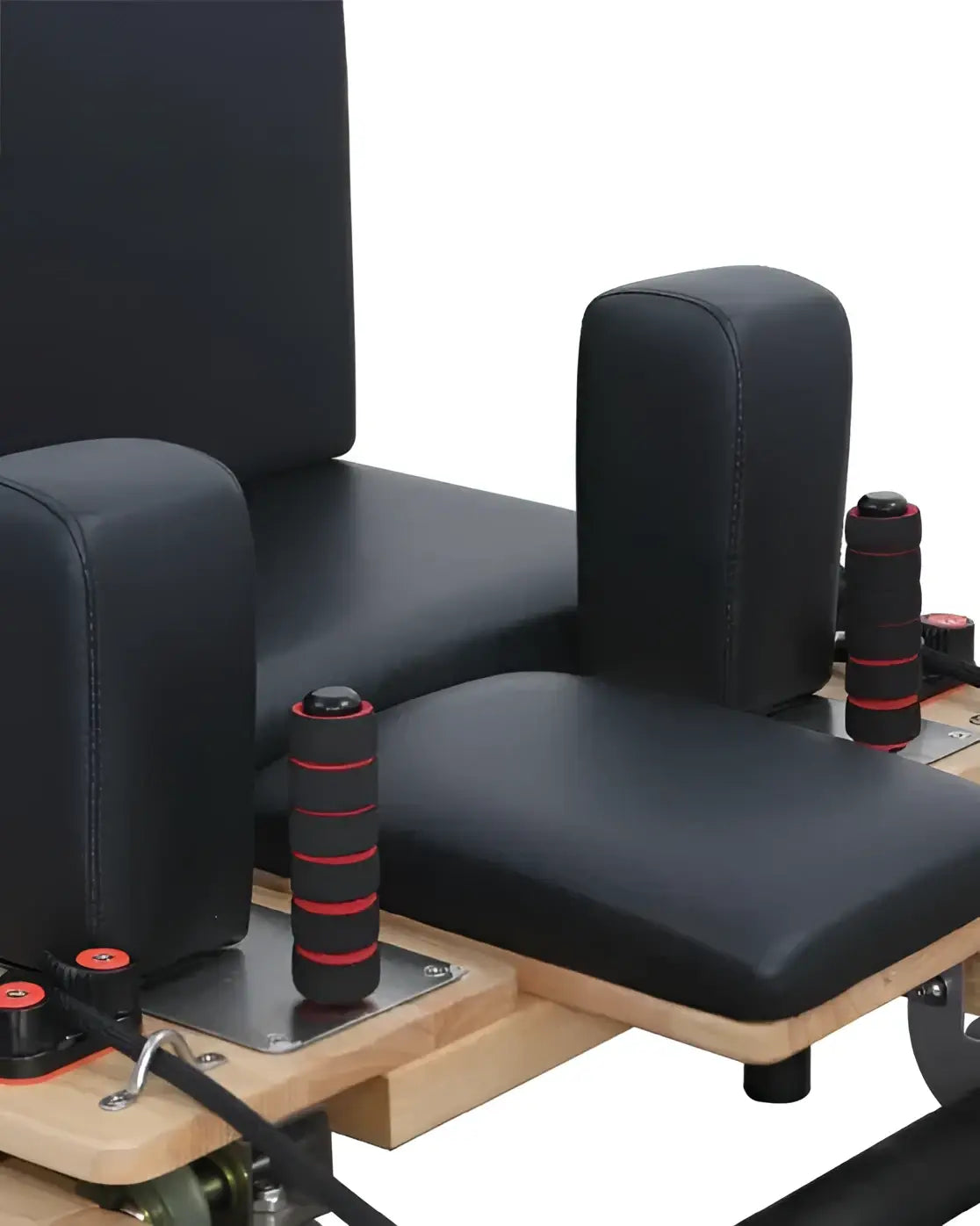 Foldable oak reformer from Gym Gear featuring adjustable straps and padded carriage for versatile Pilates workouts.